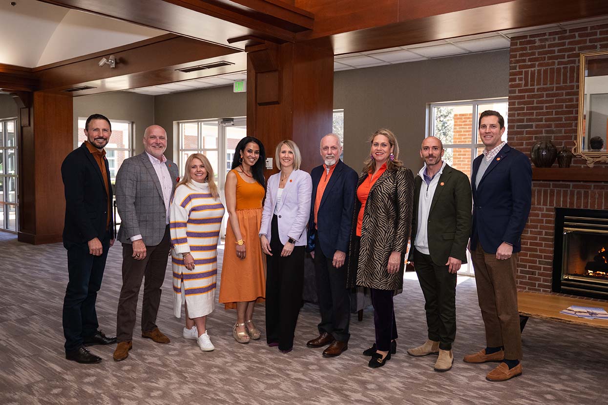 Campaign Cabinet Members posing together in the Madren Center hallway during the campaign launch in February 2025