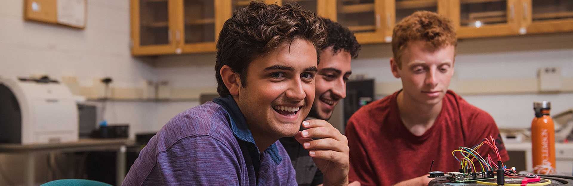 Students smiling in a classroom