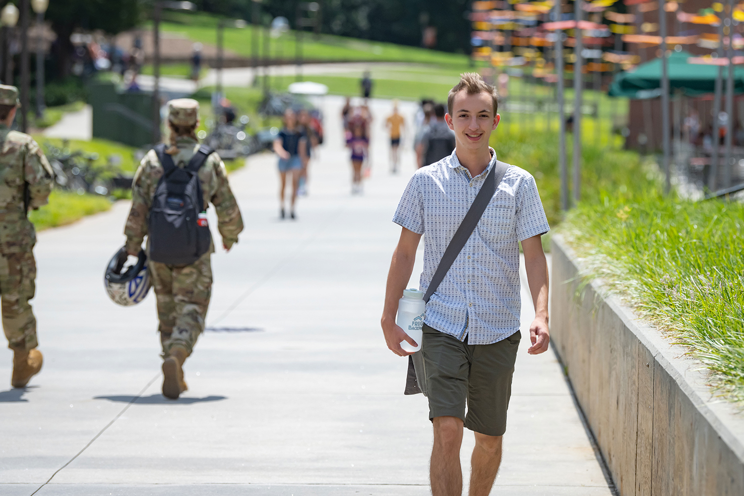 Student walking near the Clemson Honors Center on campus.