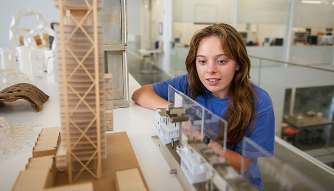 Clemson Honors student looking at a model.