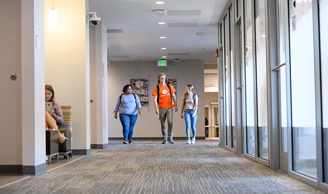 Students walking in the hallway at the Honors Center on Clemson campus.