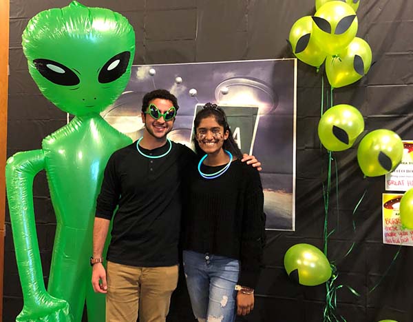 Students dressed as aliens posing at an HRC Halloween party