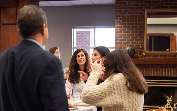 People talking at an Honors graduation event