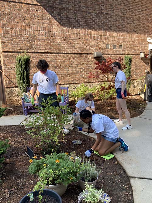 Honors (and National Scholar) students planting a garden