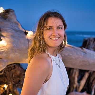 Liz Cutler standing on a beach