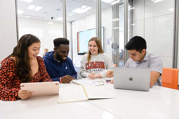 A group of Breakthrough Scholars working together in a classroom.