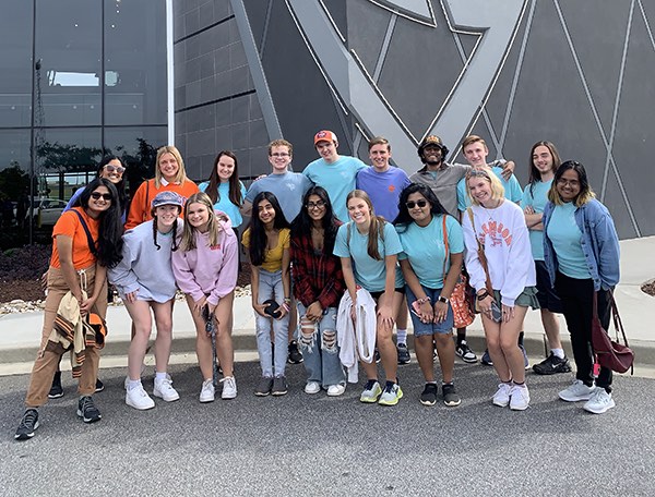 The 2022 in-person EUREKA! cohort posing together in front of Top Golf in Greenville. 