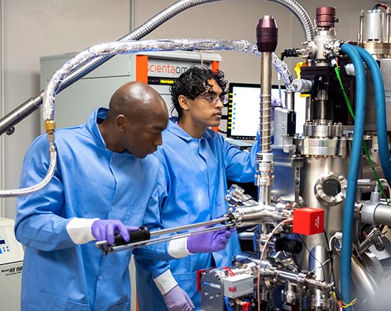 A EUREKA! student works with a graduate assistant mentor in a lab. 