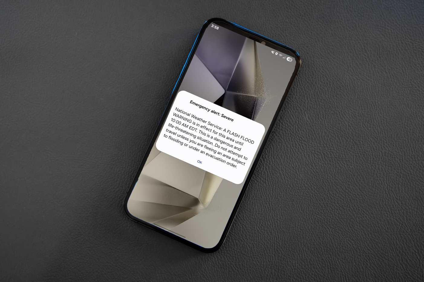 An emergency notification on the lock screen of a smartphone.
