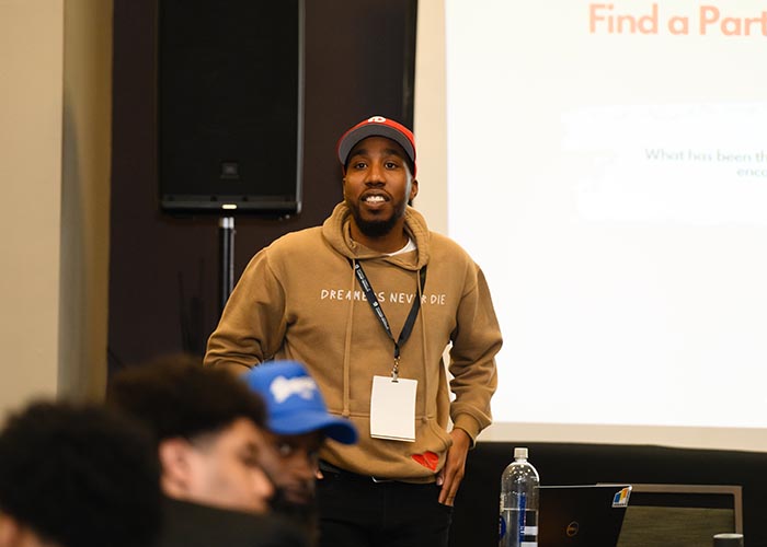 A man addresses a classroom at MOC day