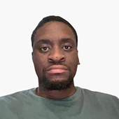 Head-and-shoulders portrait of a person wearing a green shirt against a white background.