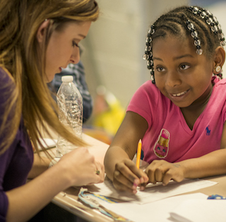 This is a decorative image of a teacher teaching a student