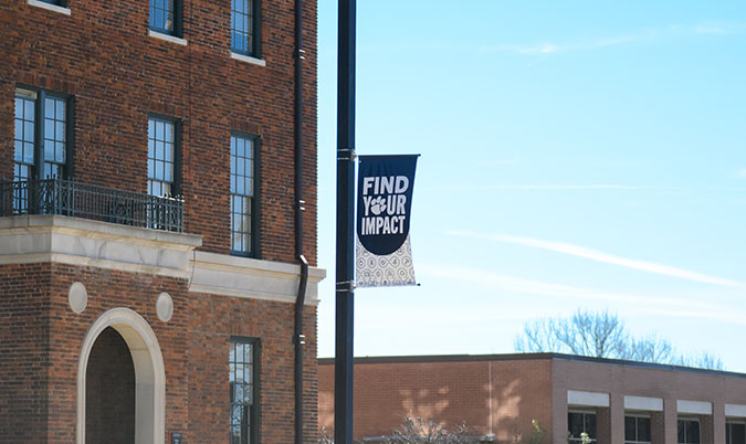 Find your purpose banner in front of a building on campus