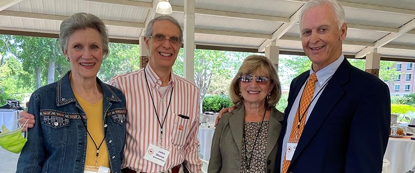 two women and two men stand smiling at the 2021 Distinguished Emeriti Award banquet