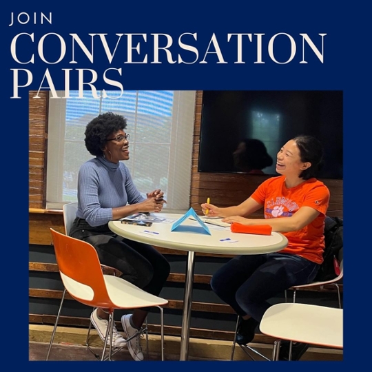 Join Conversation Pairs text overlays an image of two women laughing and talking while sitting together at a table