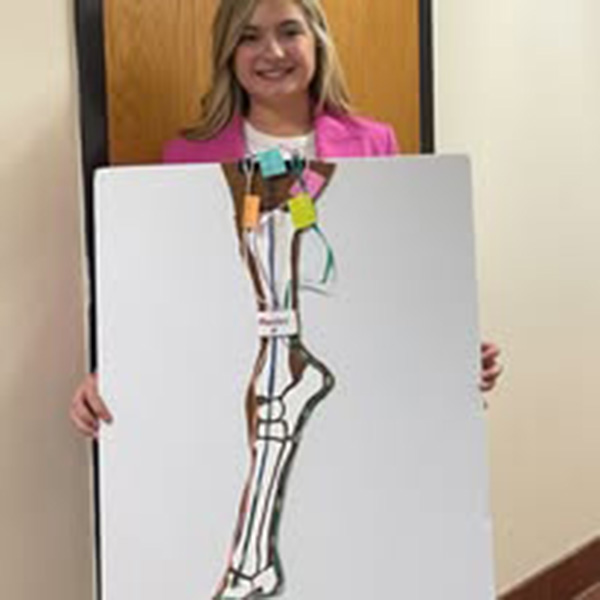 girl holding poster
