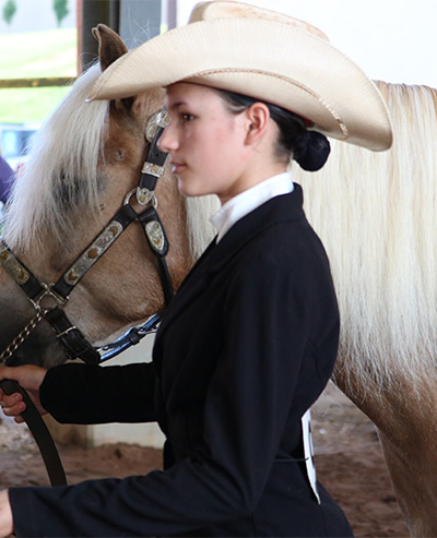 girl walking with horse