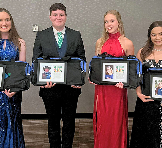 students holding their 4h awards