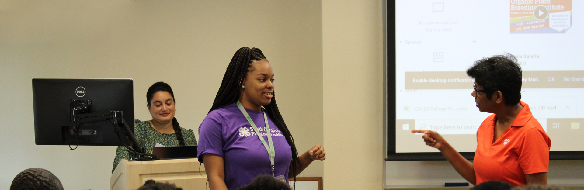 student talking with clemson faculty 