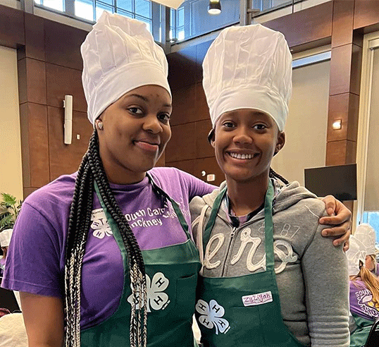 Two girls in chef hats