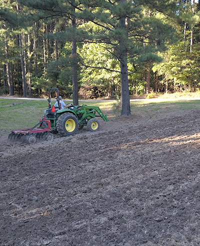 tractor discing a food plot