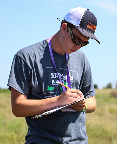 WHEP participant writing on a clipboard