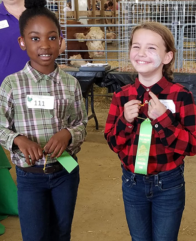 two girls with ribbons