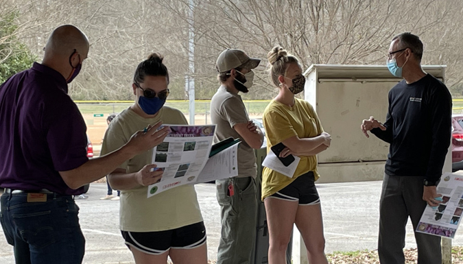 people talking at a bradford pear bounty event