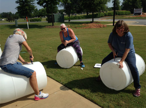 three smiling ladies working on a bmp project