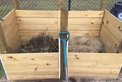 two holding bins for yard waste