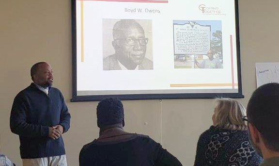 Mr. Boyd Owens speaking to a room of people