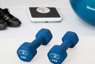 weights, scale, cleats and an exercise ball