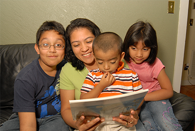 Family reading a book