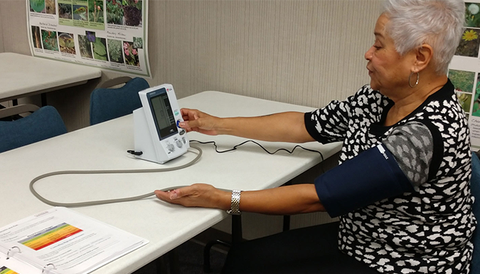 woman measuring her blood pressure