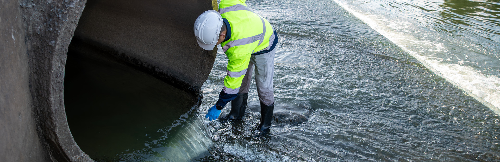 man near drainage pipe