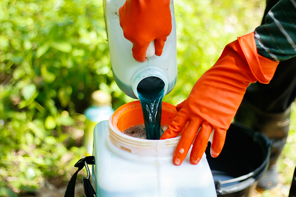 Person mixing pesticides