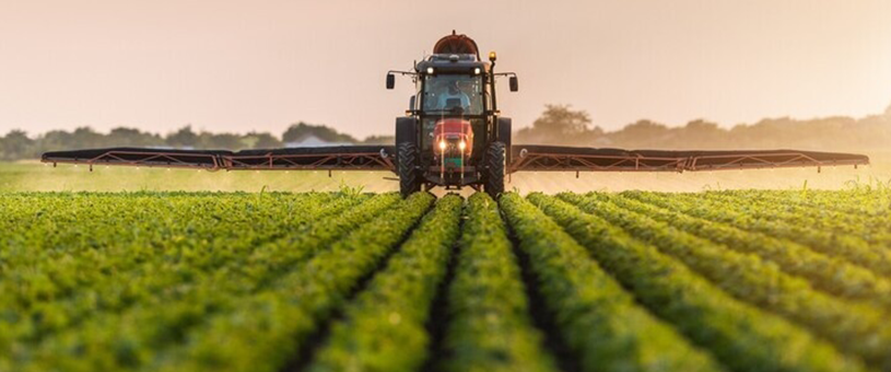 tractor spraying a field