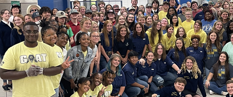 large c=group of students posing for a photo