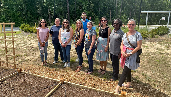 Group posing in community garden