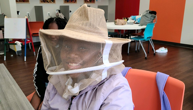 woman in bee hood
