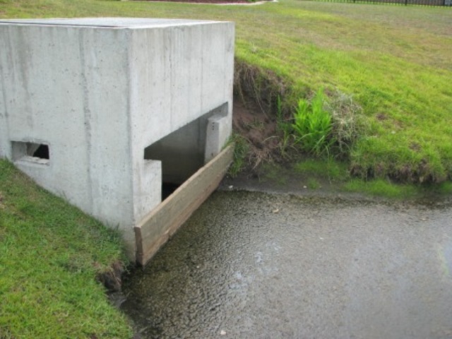 resident placed board over outfall to raise water level