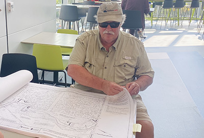 Water Resources Extension Engineer reviews site plans.
