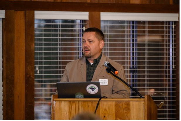 Dr. Martin Hamilton speaking at a podium