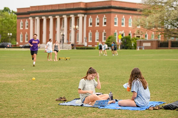 students study and play on bowman feild