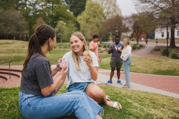 students eat ice cream outside of 55 exchange