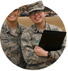 Ariel Lopes and friend poses in their ROTC uniforms on Bowman field. 