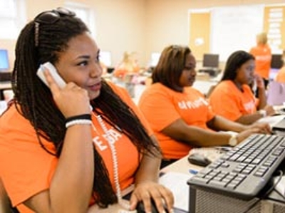 A woman answers the phone during the phonathon event