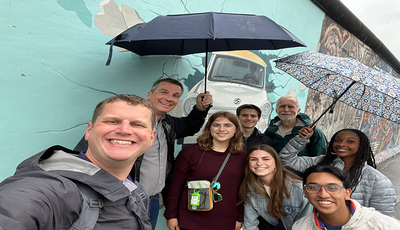 Fellows students and teachers taking a photo abroad.