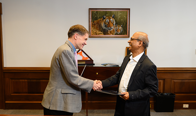 Clemson University staff shaking hand with the Indian Institute of Technology professor