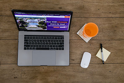 laptop on a desk with clemson.edu on the display